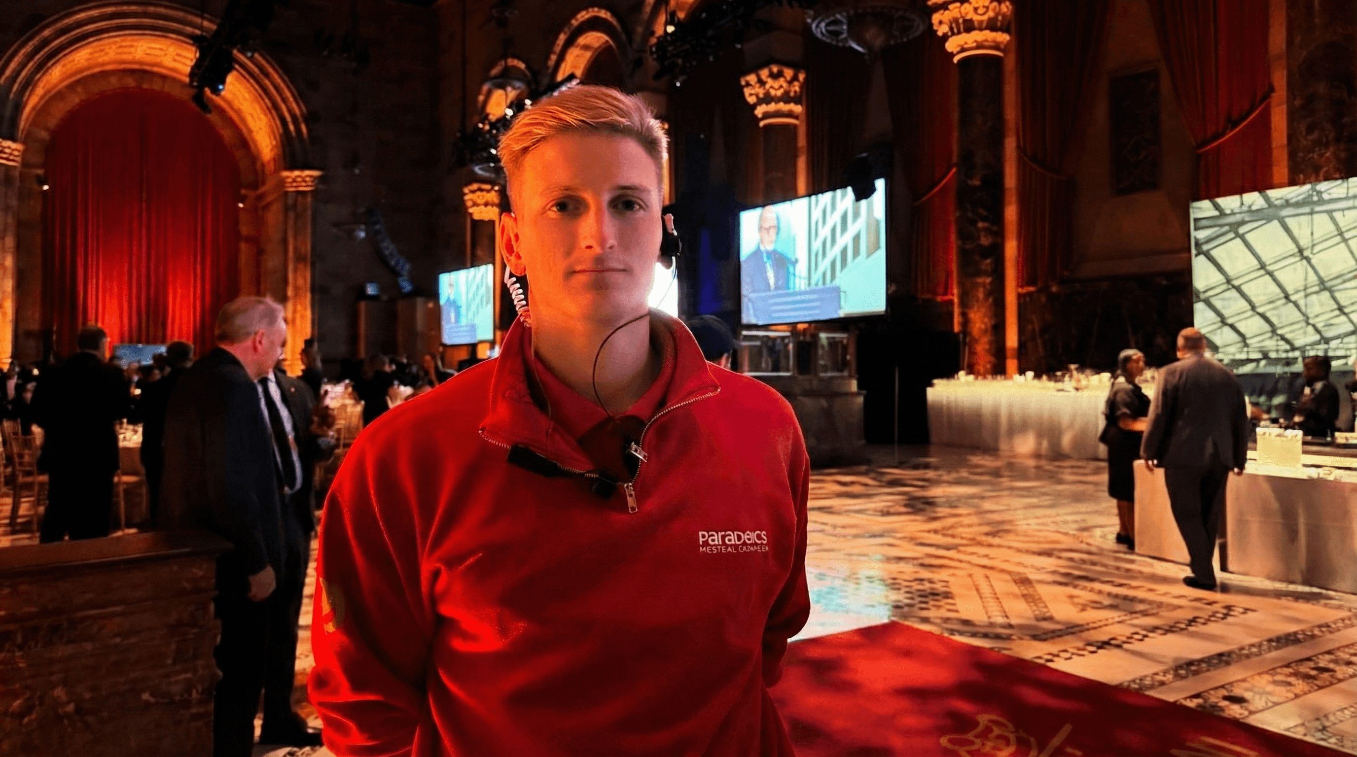 ParaDocs team member in signature red shirt at a high-profile event